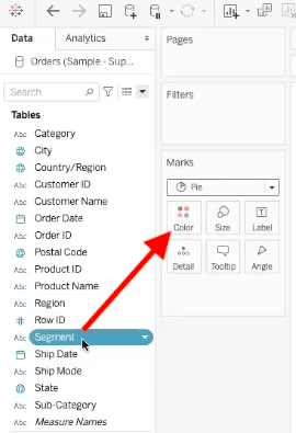 arrow highlighting path to drag segment field into colors element in pie chart in tableau