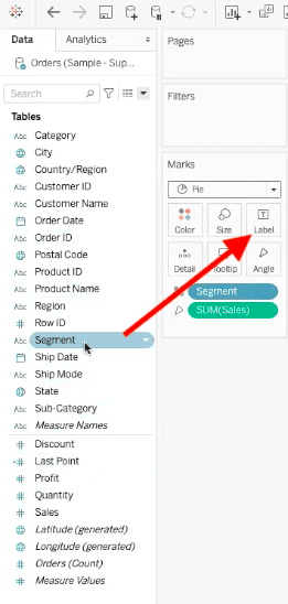 arrow showing path to drag segment field into label element of pie chart